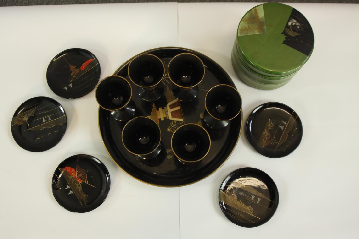 A Japanese lacquered set of six cups, a tray, five small plates housed in a round box. Each item - Image 2 of 5