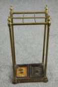 Umbrella stand, late 19th century brass and iron with lift out drip trays. H.87 W.30cm.