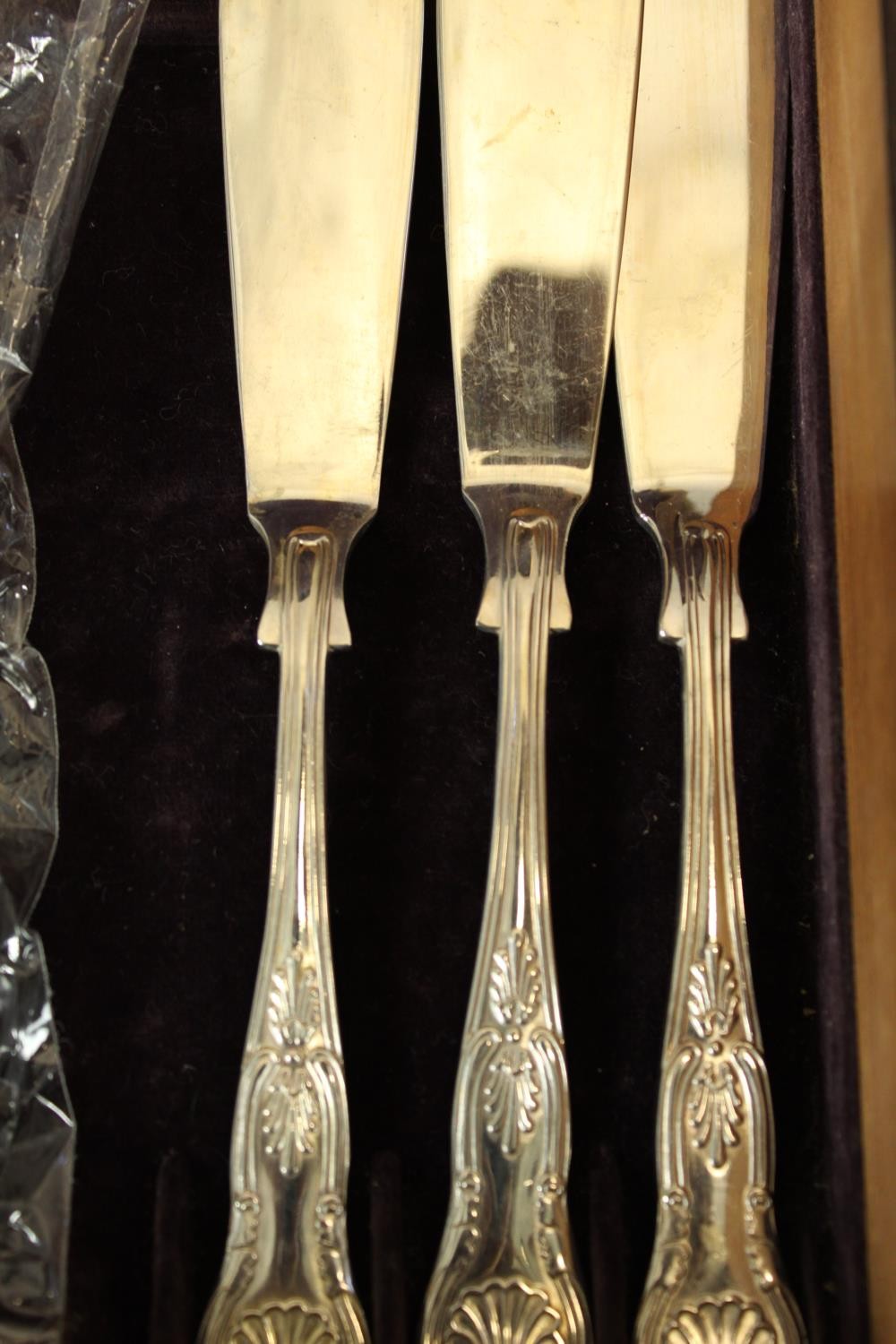 A case of fish knives and forks. A double tray of kings pattern cutlery. The box is decorated with a - Image 5 of 7
