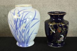 Two boxed Japanese vases, one hand decorated with irises with artist's seal to the base. H.27cm (