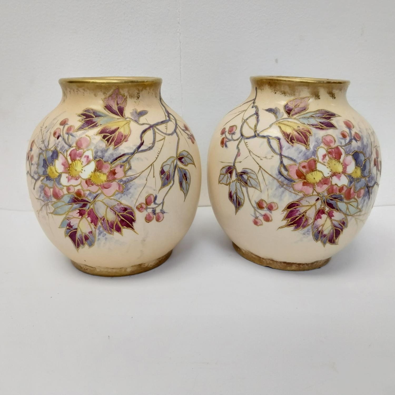 A pair of Royal Bonn hand painted ceramic vases with flower blossom decoration. Makers stamp to