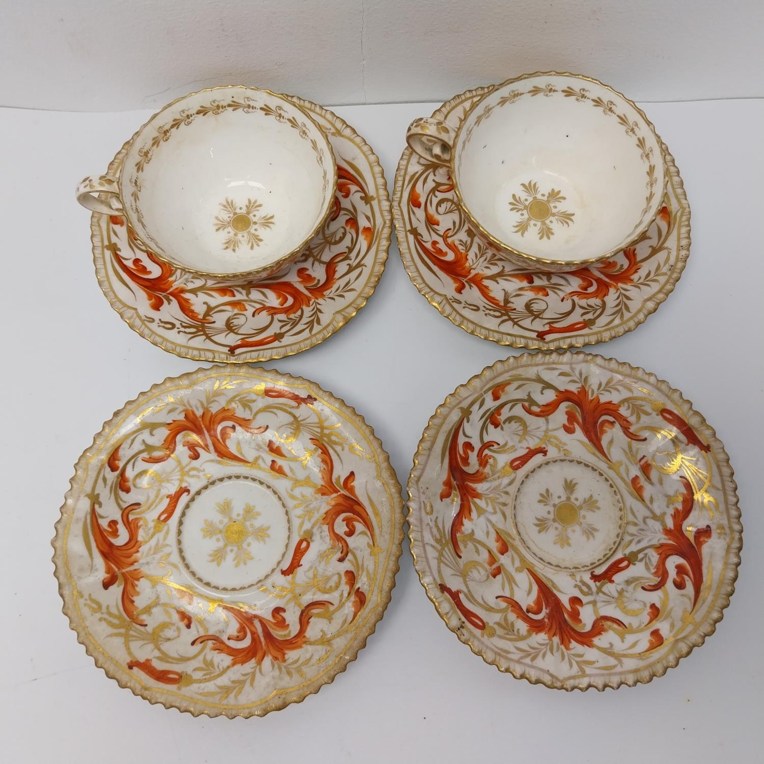 Four 19th century hand painted and gilded scrolling foliate design porcelain saucers and two - Image 2 of 2