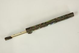 A small Japanese bone handled dagger in a sheath. The sheath delicately decorated with a enamelled