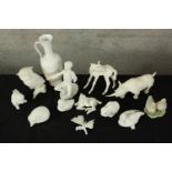 A collection of twelve pieces of mixed porcelain. A mix of animals, a jug and a child. The largest