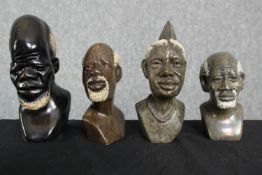 Four stone carved African male busts. The largest measures H.19 cm. (largest)
