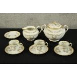 A collection of decorative G.D.A pottery to include a jug, three cup and saucer, a pot and a