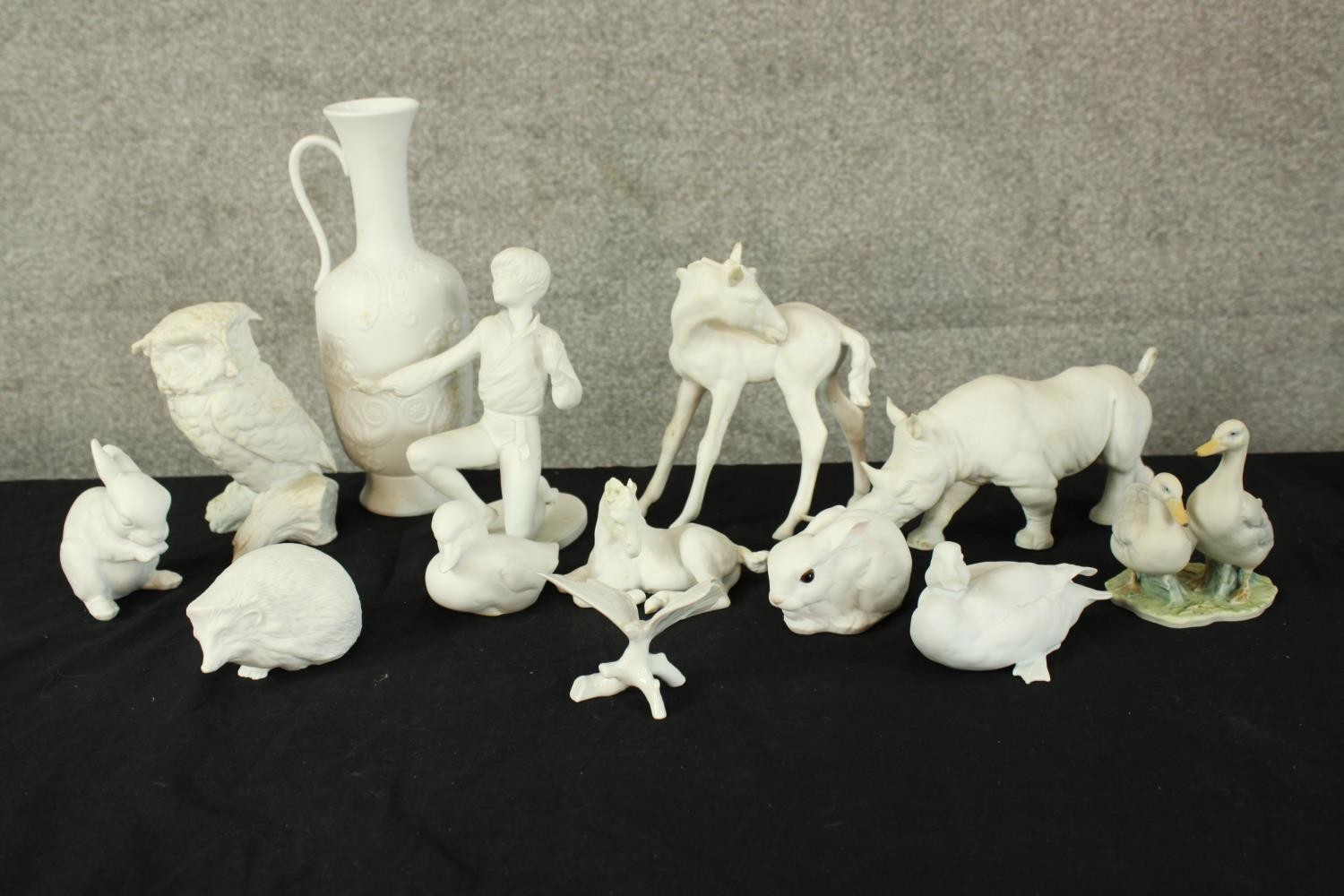 A collection of twelve pieces of mixed porcelain. A mix of animals, a jug and a child. The largest - Image 2 of 7