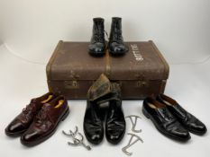 A collection of military leather dress boots and shoes. Including riding boots with attached