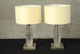 Two textured crystal lamps designed by Porta Romana. A matching pair with matching shades. H.43 cm.