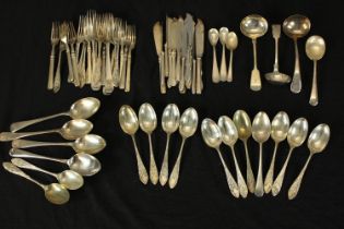 A large mixed collection of silver plated cutlery to include spoons, knifes and forks. Some with a