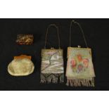 Three purses and a box. Two sequined and one silk. The lacquered wooden box is fastened with a small
