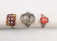 Three 20th century 9 carat gold gem-set rings, a quartz with iron pyrites and diamond flanked