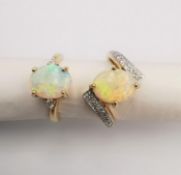 Two 14ct opal and diamond rings, one twist design with diamond accents and the other a flanked