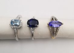 Three 20th century 9 carat gold gem-set and diamond rings, a sapphire and diamond flanked