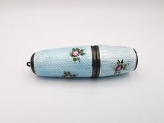 A sterling silver and guilloche enamel rose design sewing etui. Contains thread holder and lid