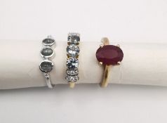 Three 20th century 9 carat gold gem-set rings, a ruby solitaire ring, a cats eye chrysoberyl three