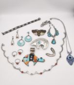 A collection of silver and white metal jewellery, including a Navaho turquoise, shell and onyx set