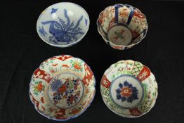A collection of four hand painted Chinese bowls. The largest with a diameter of 15 cm.