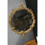 Wall mirror, C.1900 Rococo style gesso decoration. H.88 W.68cm.