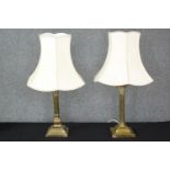 Two vintage brass table lamps with Corinthian column design. Each measures H.45cm.