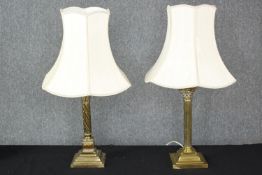 Two vintage brass table lamps with Corinthian column design. Each measures H.45cm.
