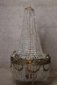 A large early 20th century basket chandelier, gilt metal and crystal drops. H.110 Dia.65cm.