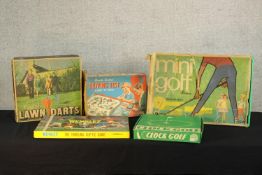 Five 20th century boxed games to include Lawn Darts, Driving Test, Clock Golf, Mini Golf &