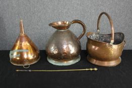 A copper jug, funnel and coal bucket with brass poker. The funnel with evidence of past repairs. The