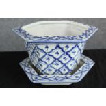 A blue and white pot planter complete with its matching tray along with another planter. H.17cm.