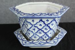 A blue and white pot planter complete with its matching tray along with another planter. H.17cm.