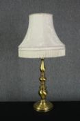 A large brass table lamp and shade. H.70cm.