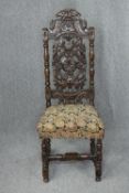 Side chair, 17th or 18th century carved oak with tapestry seat. H.128cm.