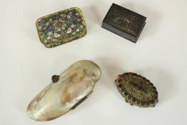 Four decorative boxes. Three boxes and a shell purse. Includes an enamelled box intricately detailed
