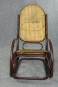Rocking chair, vintage caned and bentwood. H.105cm.