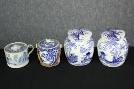 Four blue and white lidded pots. Early to mid twentieth century. The largest measures H.10cm.