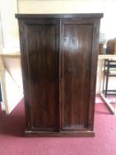 A Lombok Eastern teak wardrobe. H.187 W.115 D.63cm. (One hinge needs a repair).