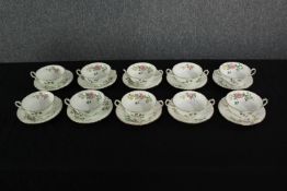 A set of Mintons bowls and saucers. With a floral design and double handles. Each with a diameter of