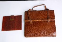 A handbag and purse. The handbag is probably made from Crocodile skin and the purse is Python