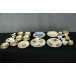 A mixed collection of nineteenth century porcelain to include cups and saucers, sugar pots and a