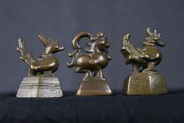 Chinese scroll weights. Three bronze chickens. Twentieth century. H.8 x W.5.5 x D.4 cm.