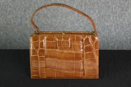 Handbag and purse. The handbag is probably made from Crocodile skin. H.28 x W.25 cm.