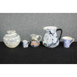 A mixed collection of four jugs and a pot. Including a modern lidded studio ginger jar. The