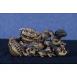A hand painted moulded Foo dog family. Circa 1950. H.10 x W.20 x D.9 cm.