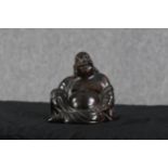 A Chinese hardwood Buddha. Twentieth century. H.18 x W.16 x D.12 cm.