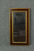 Wall mirror, early 20th century gilt and rosewood frame. H.64 W.34cm.