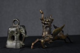 Tibetan bronze temple lion/foo dog along with a bronze weight in the form of an elephant. H.14 X W.