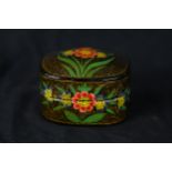 A Japanese lacquered lidded pot with floral decoration. Twentieth century. H.4 x W.6 x D.5 cm.