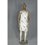 A mannequin wearing an Eiffel Tower apron. Possibly from an art installation. H.178 cm.
