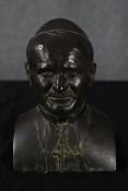 A bronze resin bust of Pope John Paul II. H.24 W.17 D.10 cm.