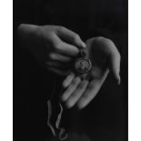 Jane E. Clark. Photograph. Hands holding a locket. From the artis'ts Great War series of works.